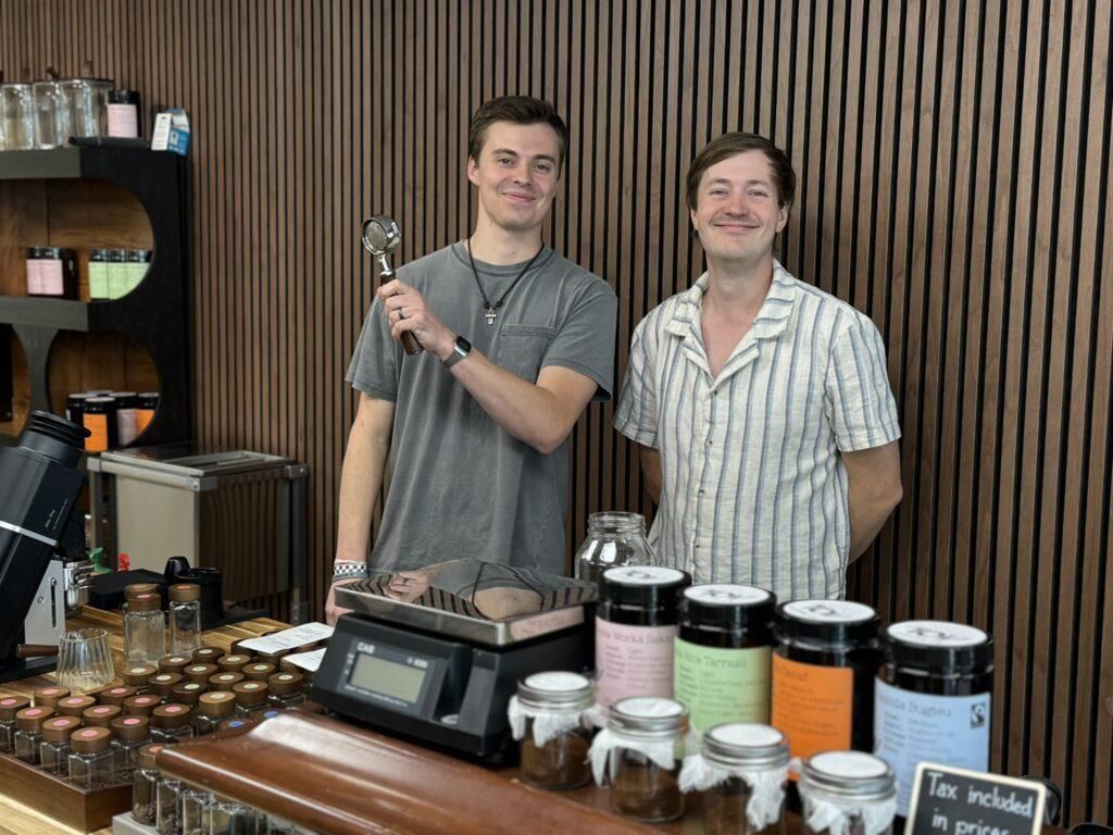 Matt and Mason behind the coffee bar at Fig Tree Market