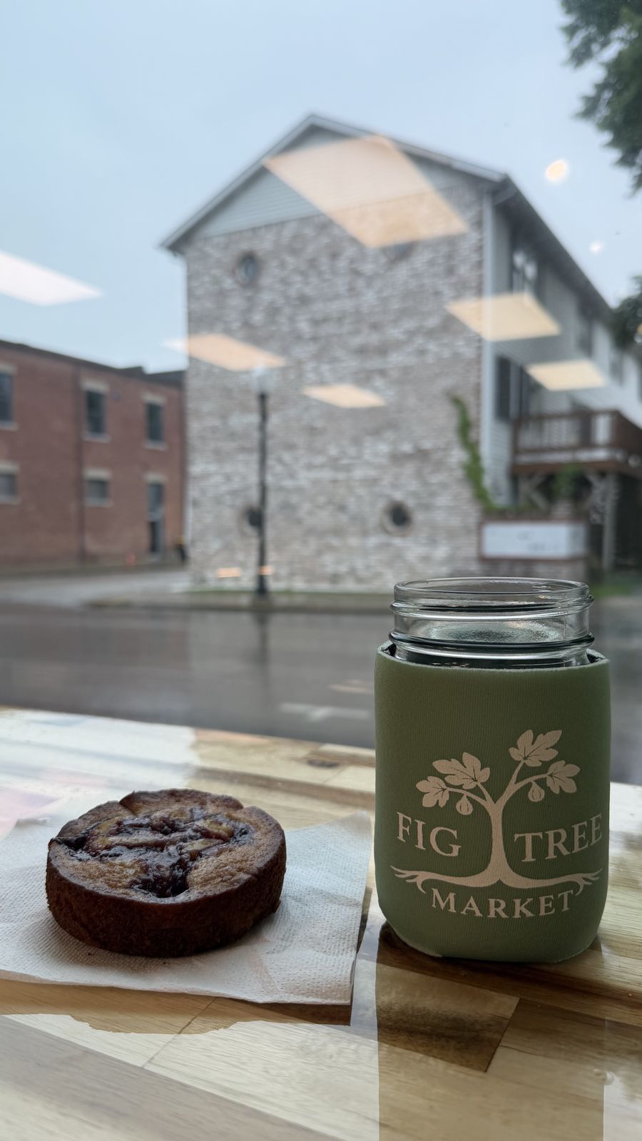 A coffee and a pastry on the bar at Fig Tree Market
