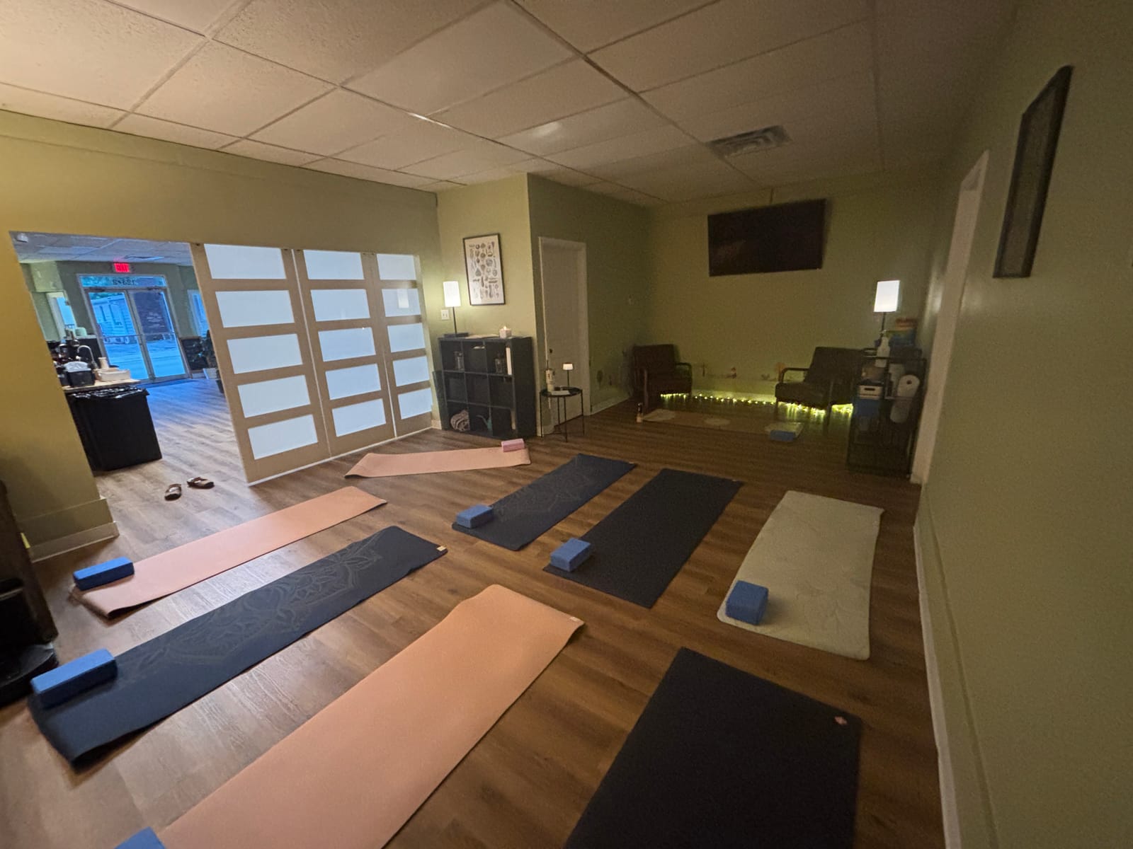 The yoga studio at Fig Tree Market, set with mats and warm lighting